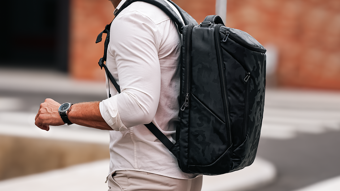 MarkRyden Global black camouflage anti-theft backpack worn outdoors