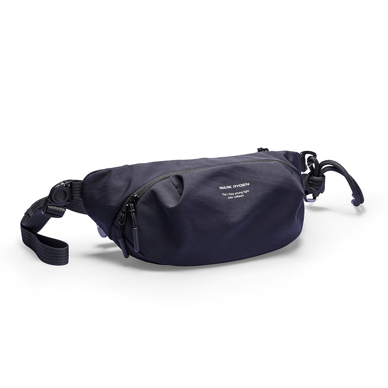 Navy blue Mark Ryden ChillFlex sling bag with zippered front pocket, adjustable crossbody strap, and minimalist design for everyday use.