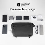 Black Mark Ryden CityWalk large capacity spacious waterproof messenger bag with YKK zipper, surrounded by phone, wallet, camera, and other essentials to demonstrate storage capacity.