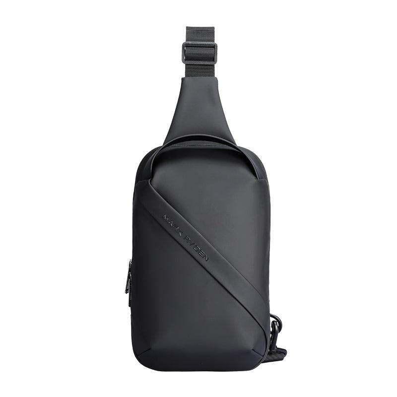 Black waterproof crossbody bag with sleek design, diagonal strap, and Mark Ryden branding—simple, clean, large capacity for modern travelers.
