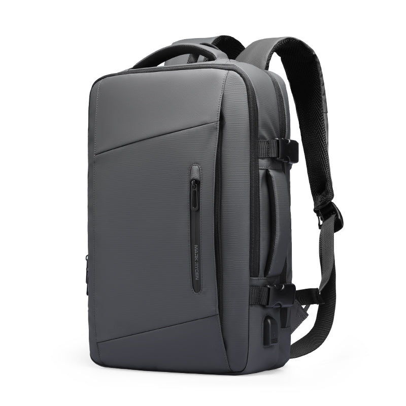 Dark gray Mark Ryden Expandos versatile expandable laptop backpack with front zipper pocket, padded adjustable straps, side USB port, perfect for all-day travel.