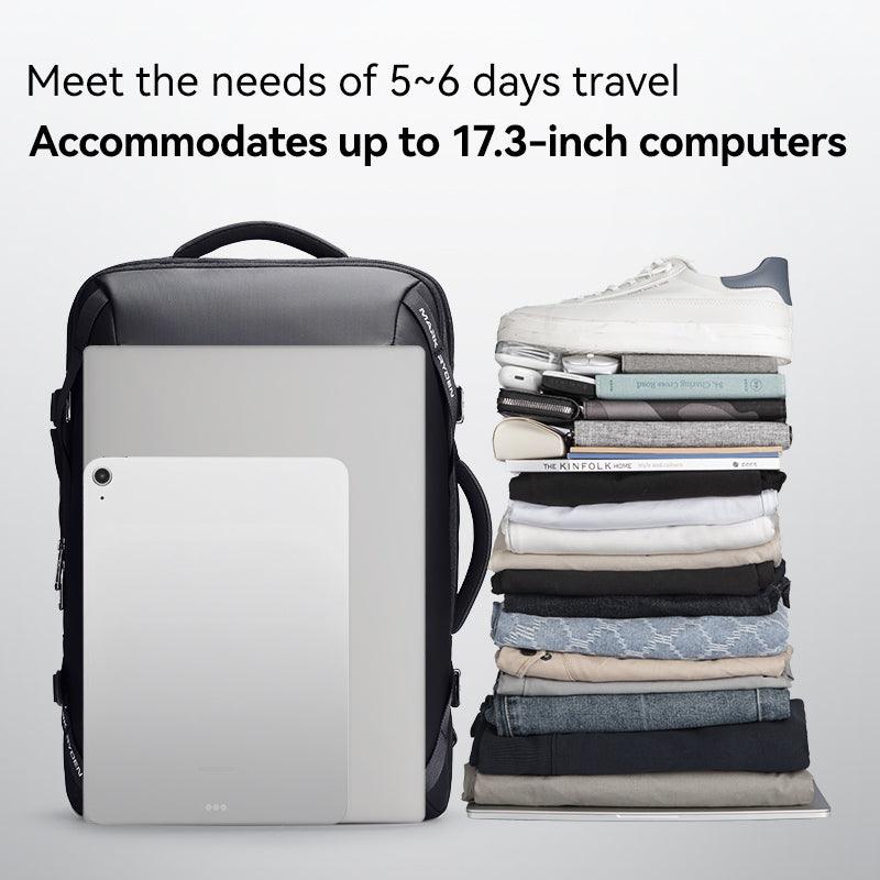 Infinitely Multi-functional Large Capacity Backpack in black, holding 17.3-inch laptop, beside stack of clothes, shoes, and travel essentials for 5-6 days travel.