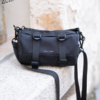 Mark Ryden black cylinder crossbody bag with straps, anti-theft style