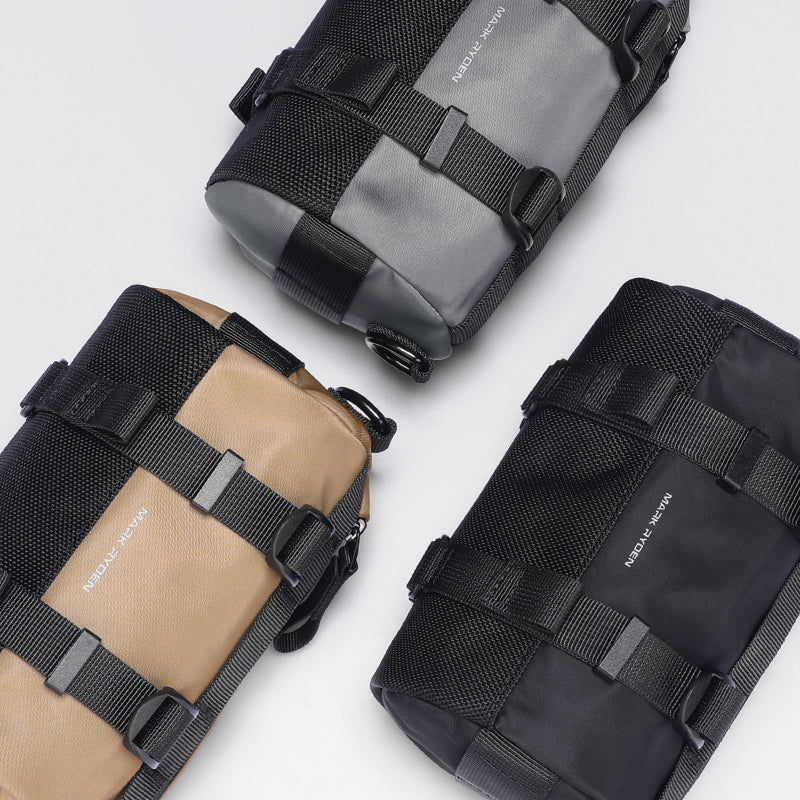 Mark Ryden MotoBarrel cylinder crossbody bags in tan, gray, black with straps