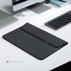 Modern slim black laptop sleeve for 13.3-15.4 inch laptops on clean desk