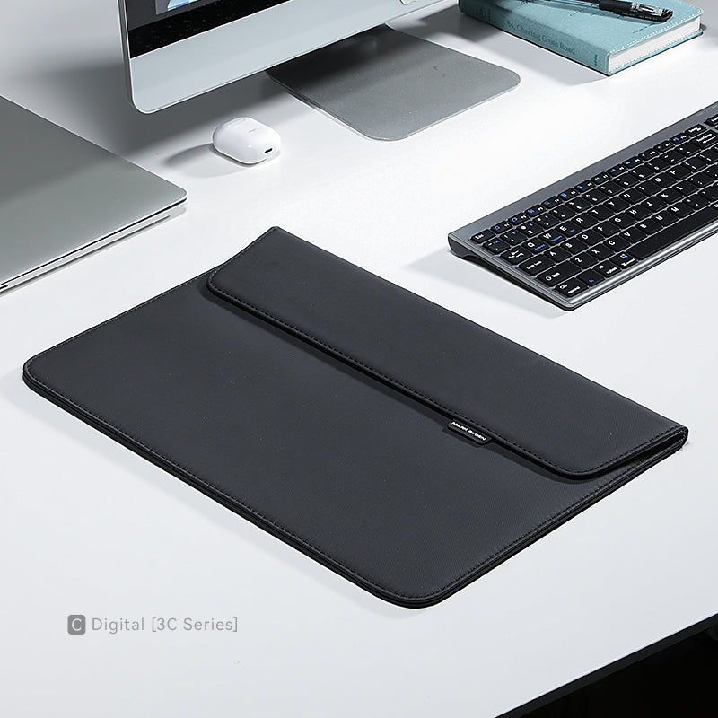 Modern slim black laptop sleeve for 13.3-15.4 inch laptops on clean desk