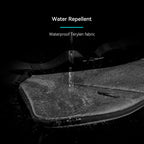 Gray ChestFlex modern urban chest bag with water beading off its waterproof Terylen fabric, demonstrating water repellent feature.