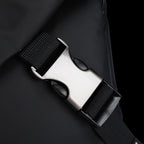 Silver metal buckle on black strap of Harvey leather waterproof multifunction messenger bag