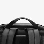 Mark Ryden Global's black splash-proof commuter backpack with sturdy handle