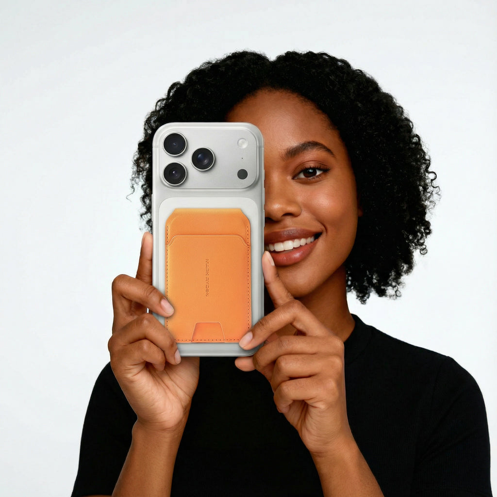 Mark Ryden Global slim orange MagSafe card holder wallet on smartphone