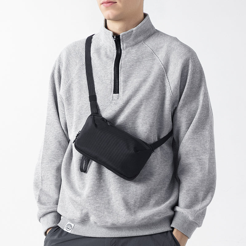 MarkRyden Global black convertible toiletry crossbody bag with adjustable strap for modern traveler