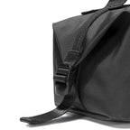 Black waterproof backpack strap & buckle detail | MarkRyden Global travel organizer
