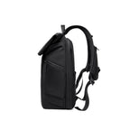 Black MorphCore 27-36L adaptive expandable backpack with roll-top closure, multiple compartments, padded straps, and sleek design for modern travelers.