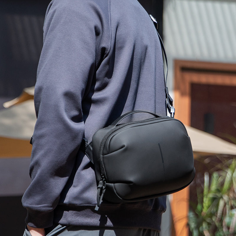 MarkRyden Global's AquaLite waterproof PU sling bag in black for modern daily use