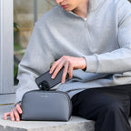 Mark Ryden gray anti-theft travel pouch holding smartphone for modern travelers