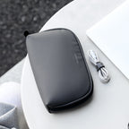 MarkRyden Global NanoGrid gray zippered digital toolkit with cable on white table