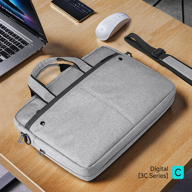 Gray MarkRyden commuter briefcase with laptop, mouse, phone on wooden desk