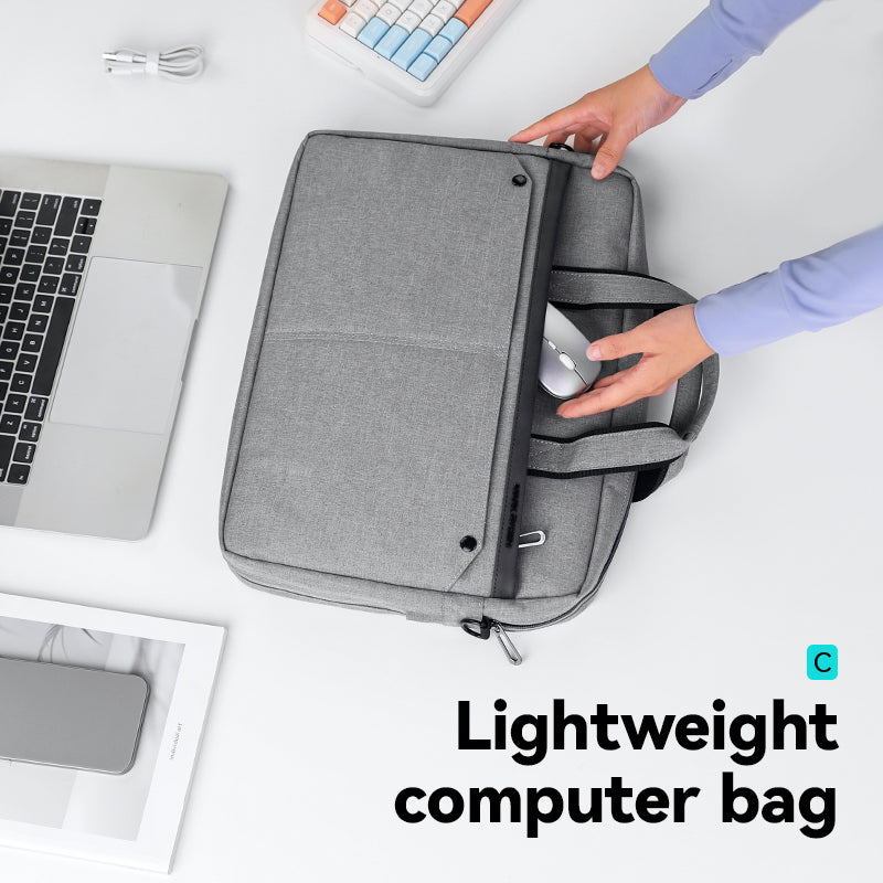 Gray MarkRyden tech commuter briefcase opening with laptop