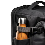 Mark Ryden Aegis Fortress backpack with wooden water bottle in side pocket