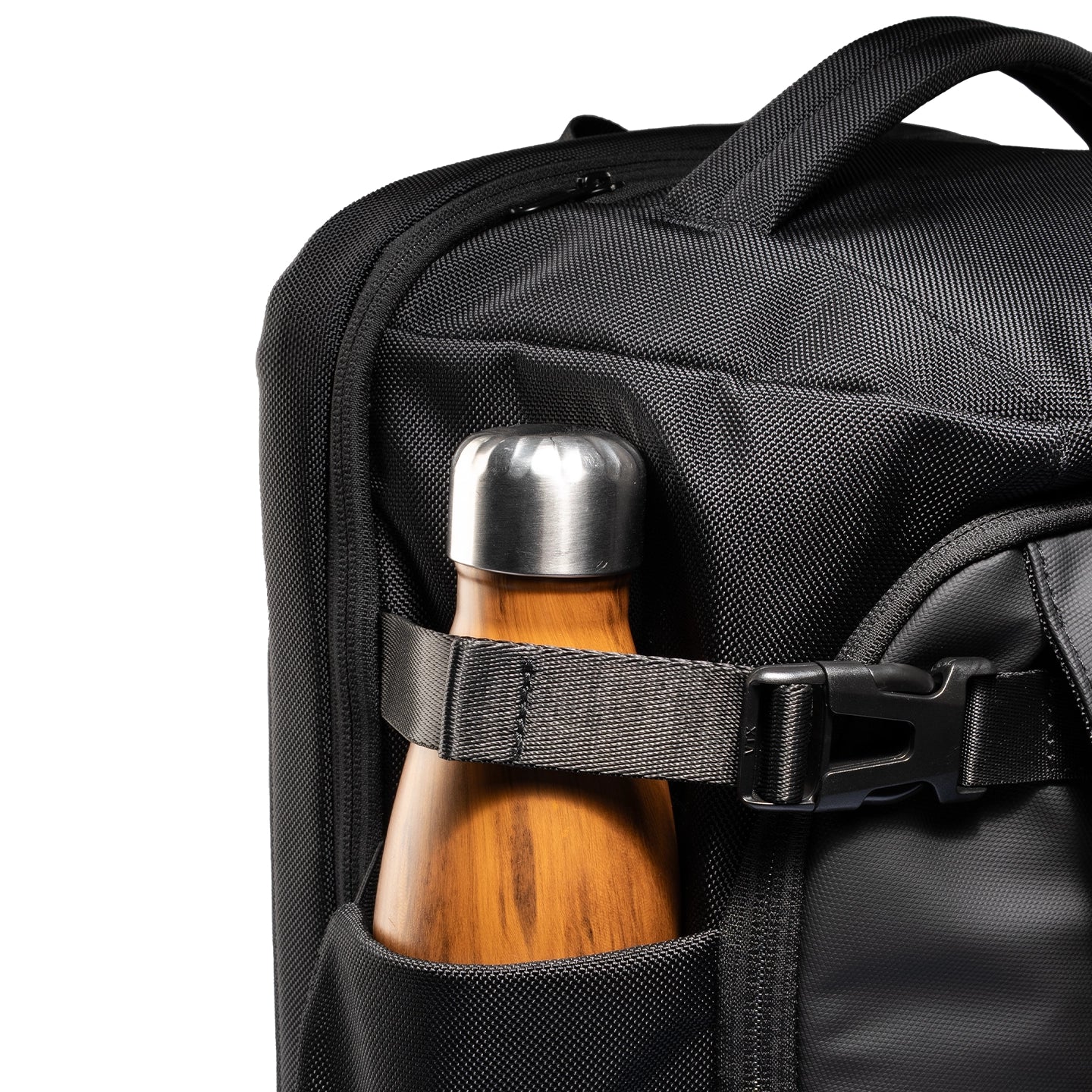 Mark Ryden Aegis Fortress backpack with wooden water bottle in side pocket