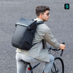 Mark Ryden Global black multifunctional backpack on urban cyclist