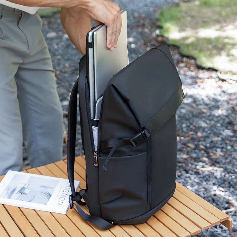 Mark Ryden Global black multifunctional anti-theft backpack with laptop on outdoor table