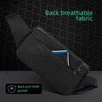 Black compact cross-body sling bag with textured fabric, front zip pocket holding a smartphone, and back features breathable fabric and anti-theft pocket—perfect for daily essentials.