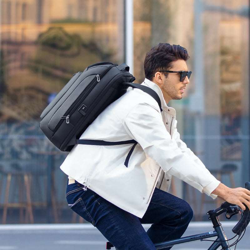 MarkRyden Global Transforma expandable backpack on cyclist