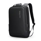 Black futuristic minimalist lightweight backpack by Mark Ryden, featuring USB port, multiple zippered compartments, and padded shoulder straps.